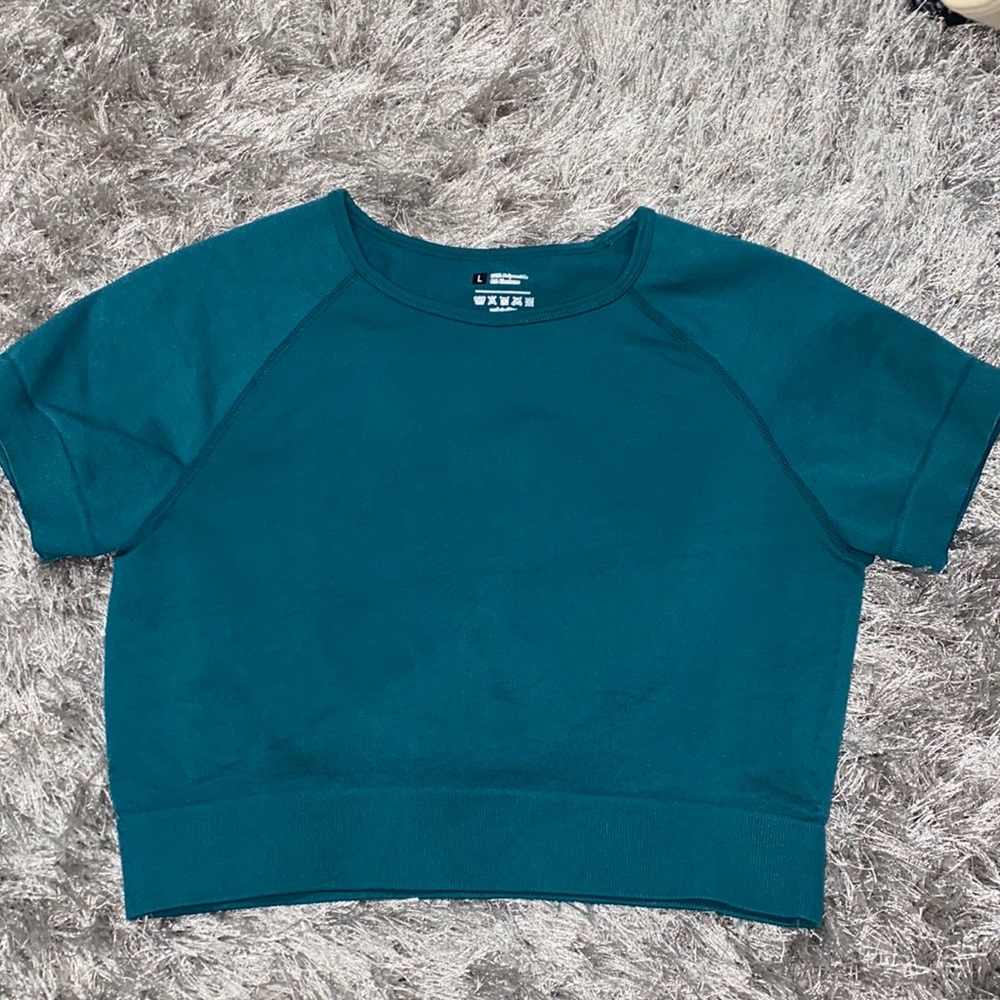 3 cropped workout shirts and a cropped tank top
